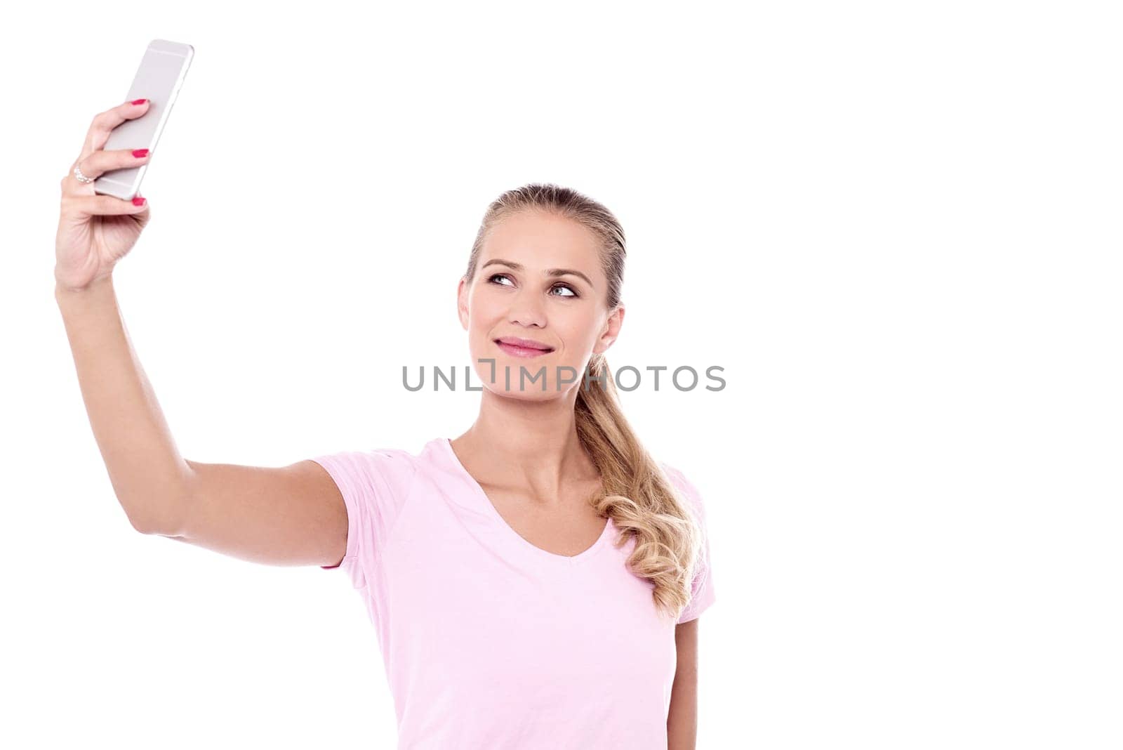 Pretty woman clicking a selfie with smartphone