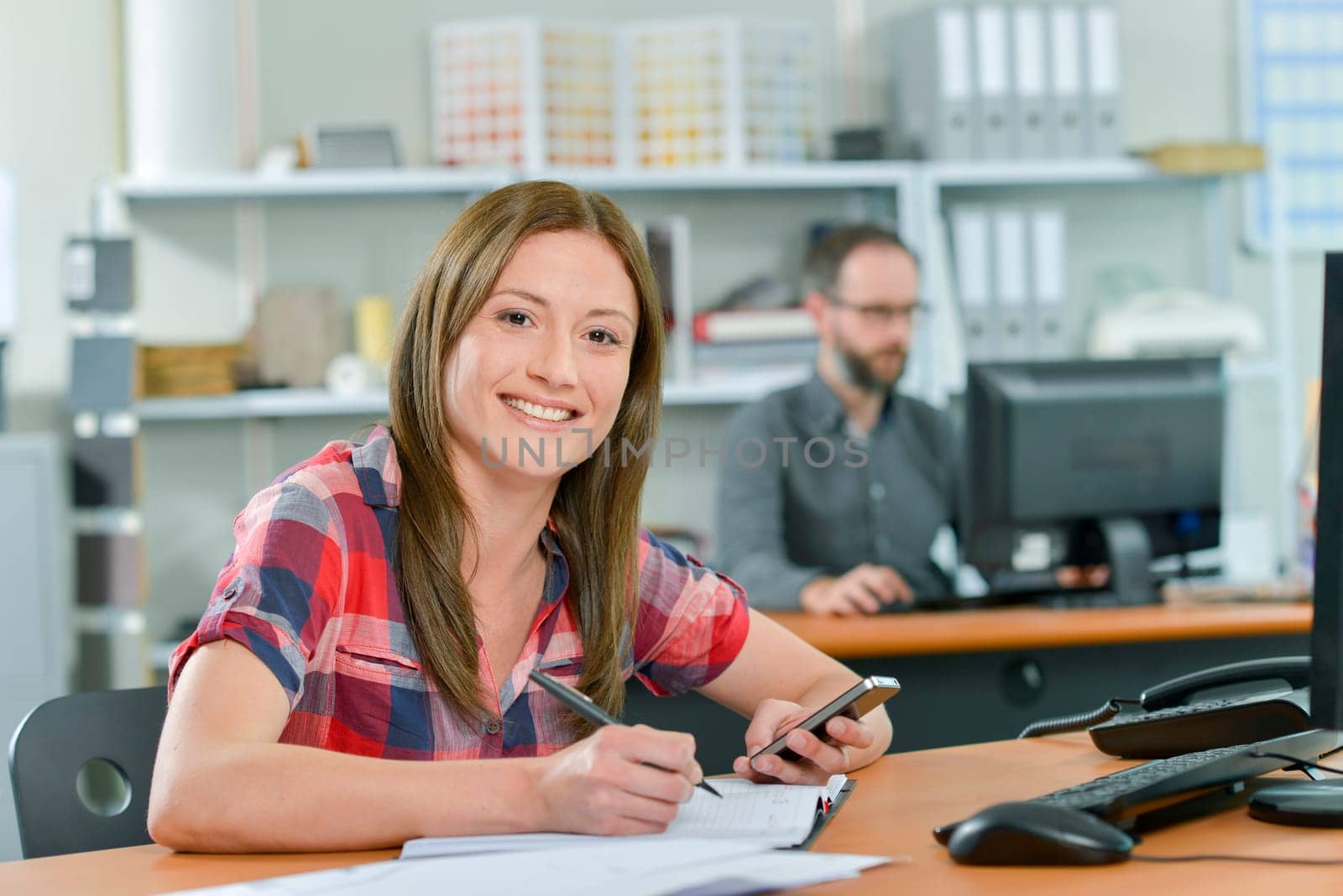 Office worker reading a text message