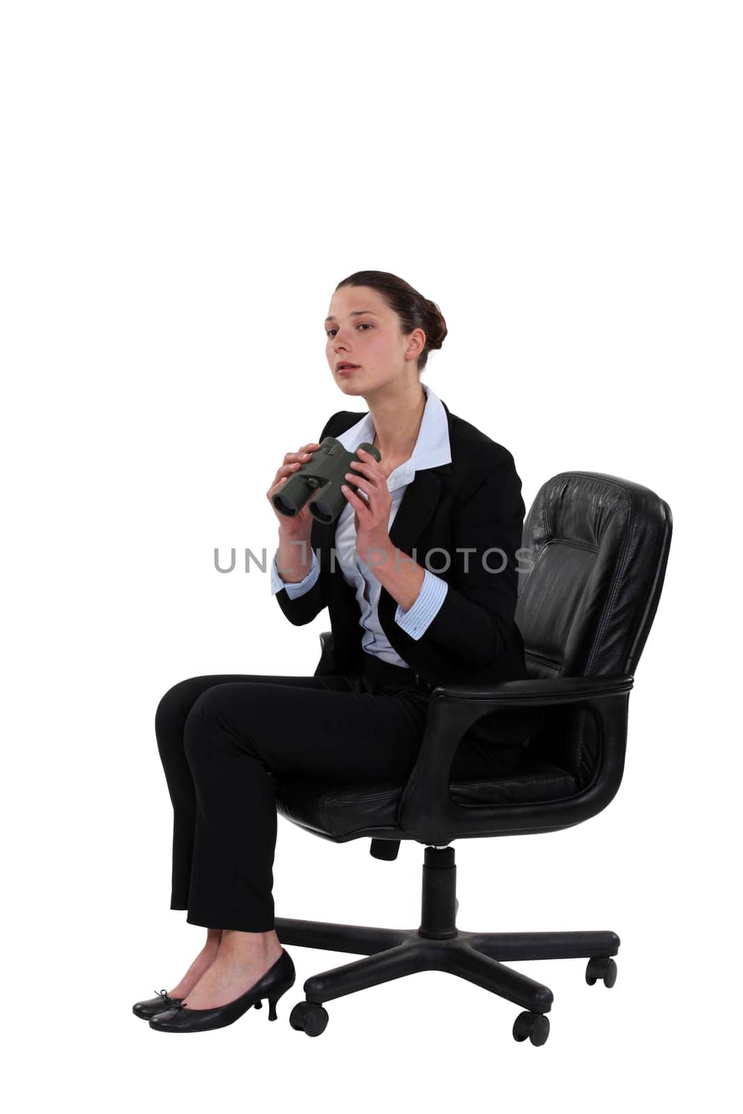 Businesswoman sat with binoculars