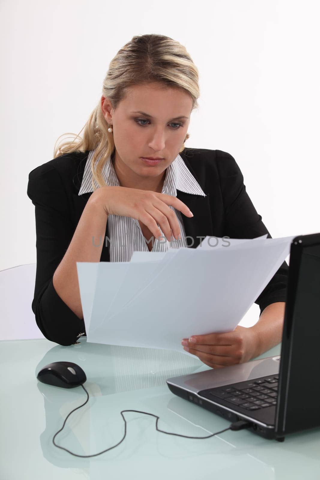 blonde  businesswoman going through files