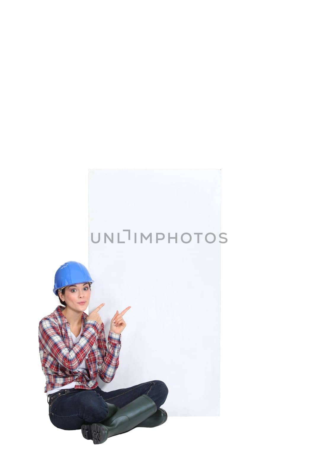 Female builder sat pointing