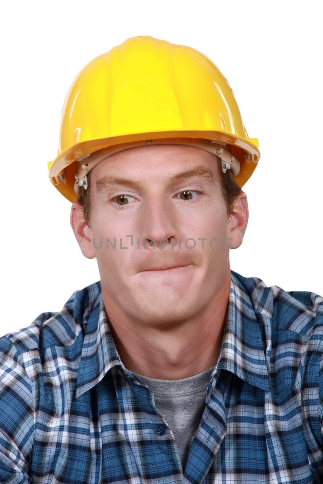 Construction worker biting his lips.