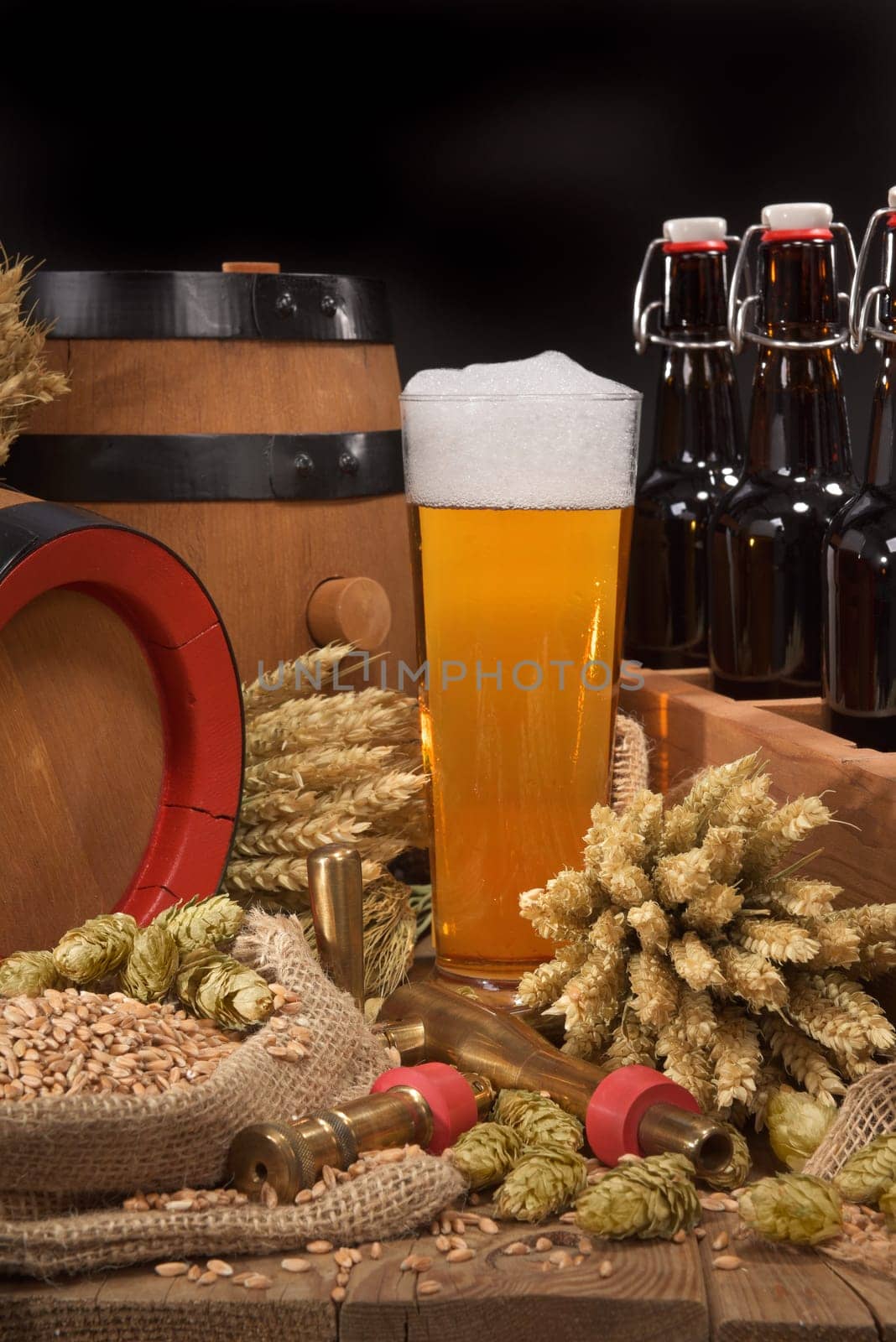 old beer carrier with beer glass,wheat,barley,hops and malt