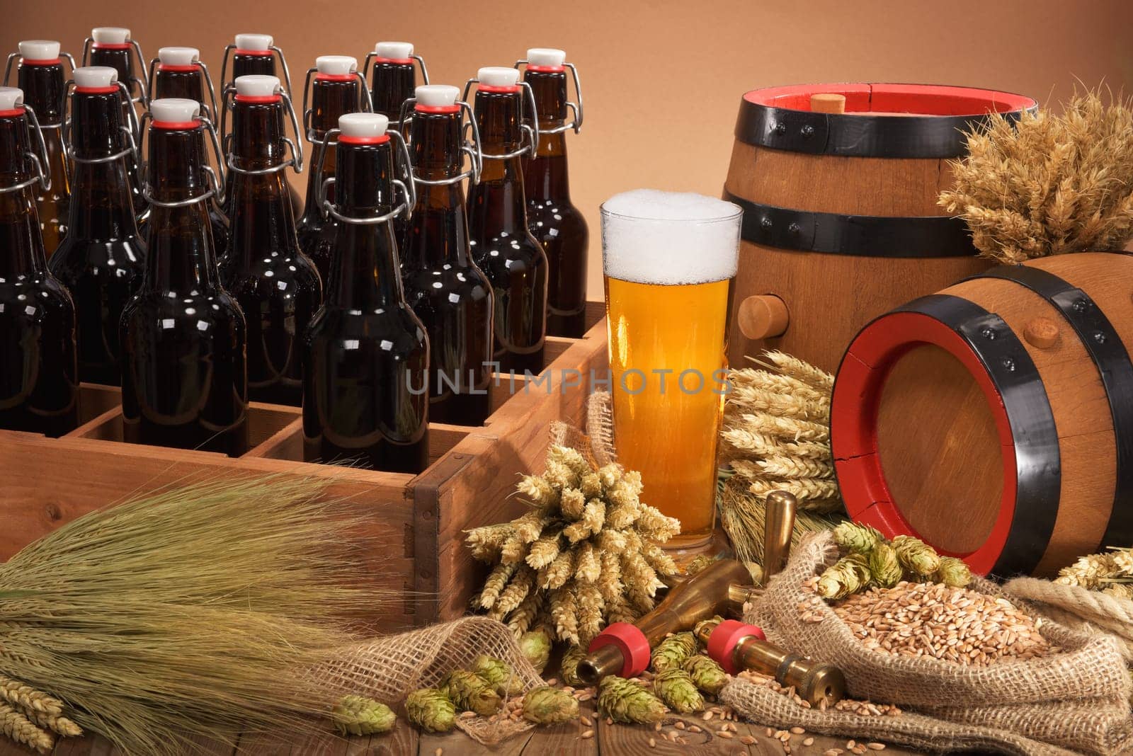 old beer carrier with beer glass,wheat,barley,hops and malt