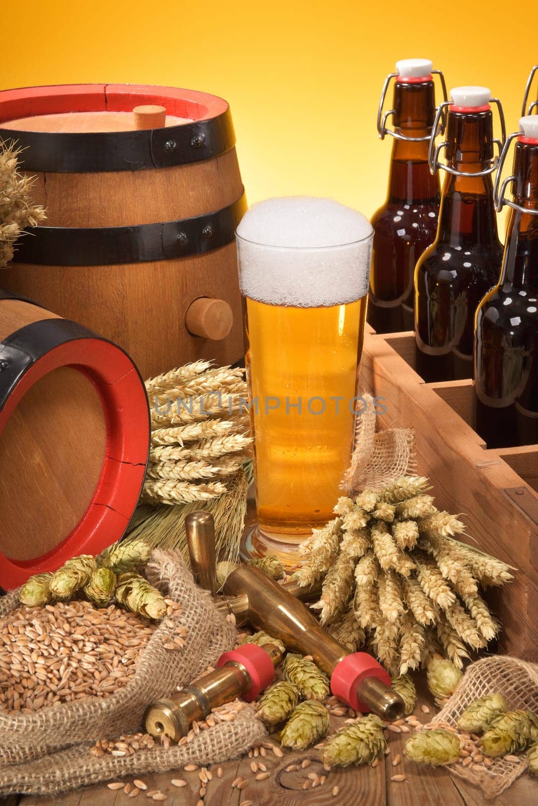 old beer carrier with beer glass,wheat,barley,hops and malt