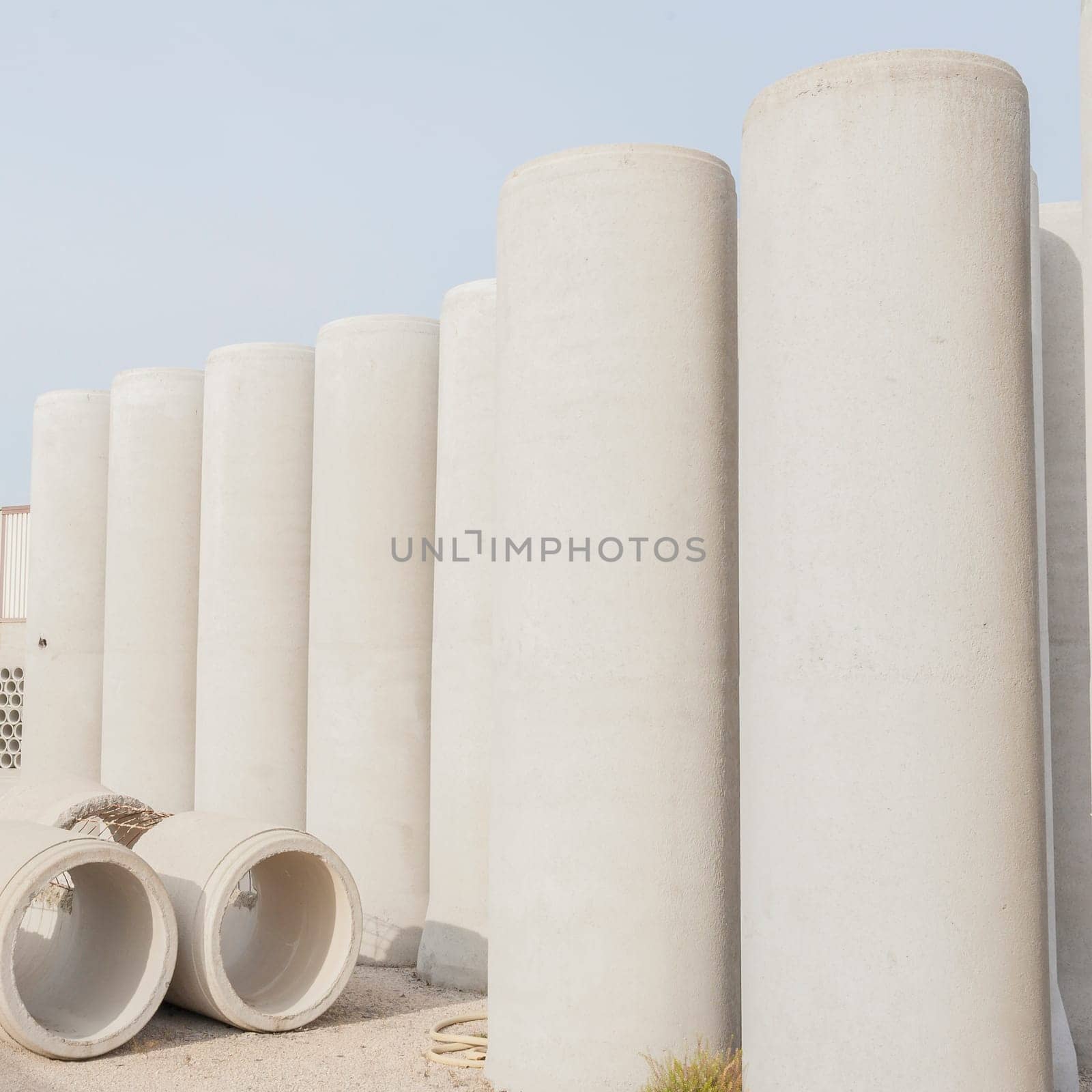 Concrete drainage pipes for industrial building construction.