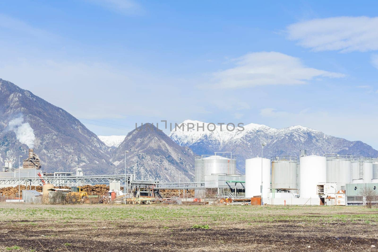 Tanks of chemicals, lumber and chimney of a furniture industry.