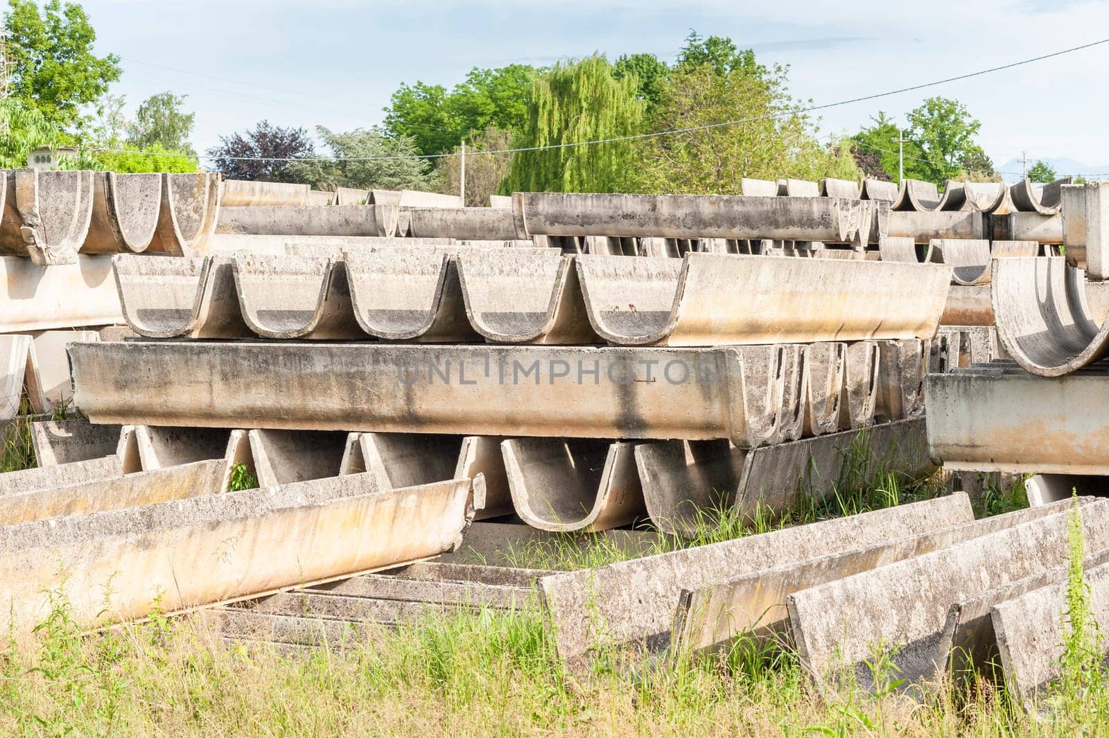 Stack of prefabricated concrete for the construction of irrigation channels for agriculture.