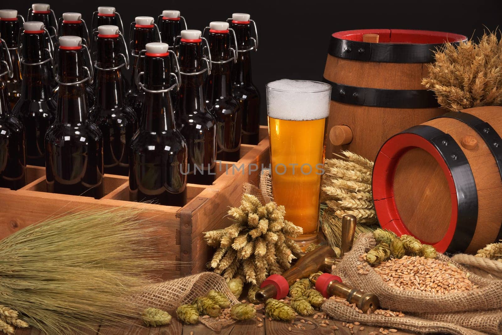 old beer carrier with beer glass,wheat,barley,hops and malt