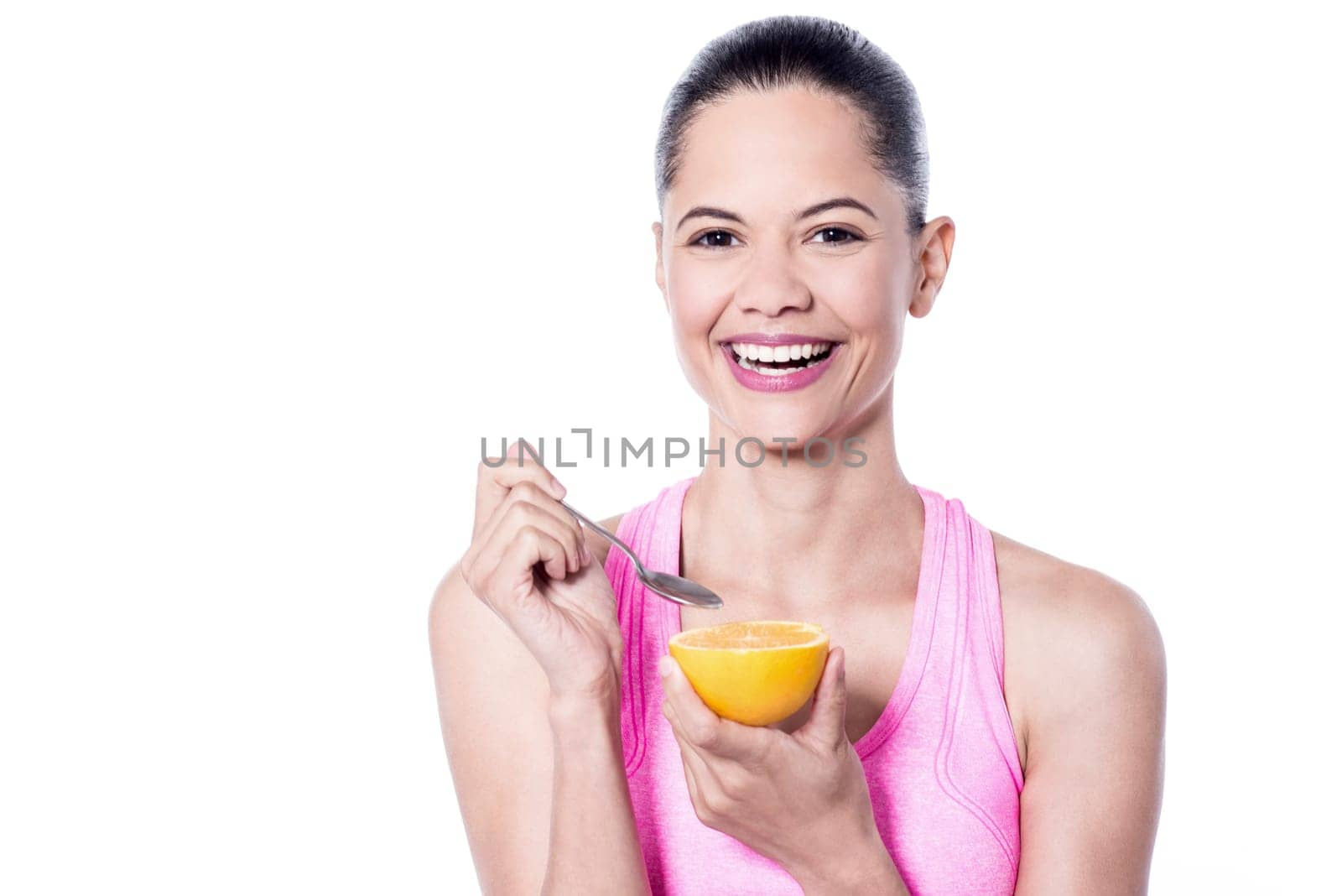Smiling woman having an orange