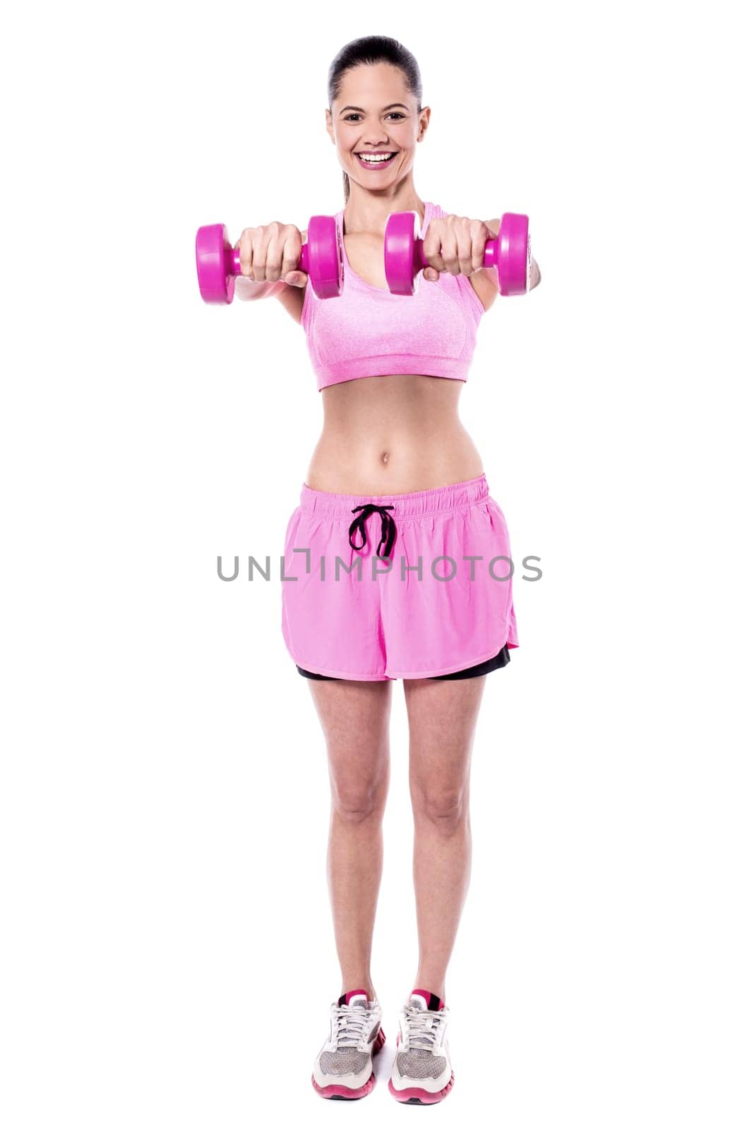 Full length woman holding dumbbells