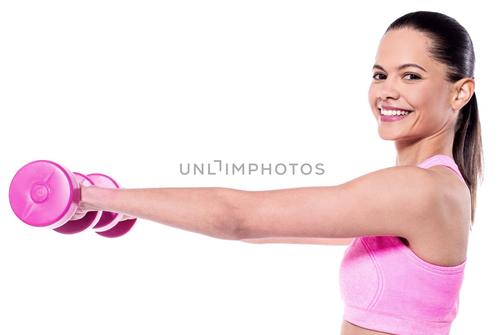Joyful woman exercising with dumbbells