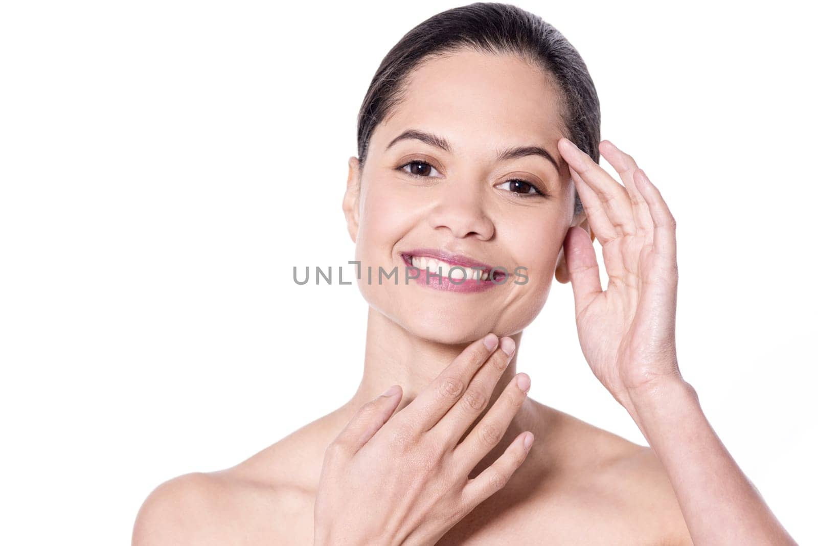Beautiful woman touching her face over white