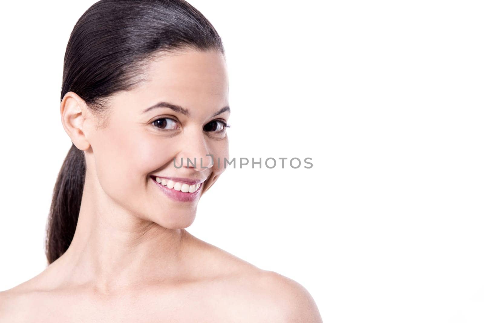 Happy woman posing to camera with bare shoulders