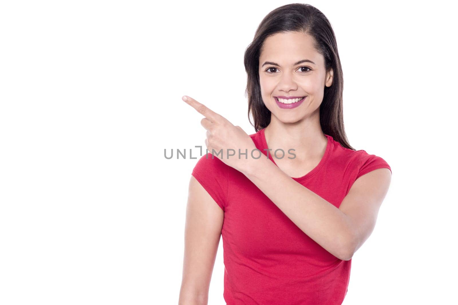 Casual young woman pointing to the side