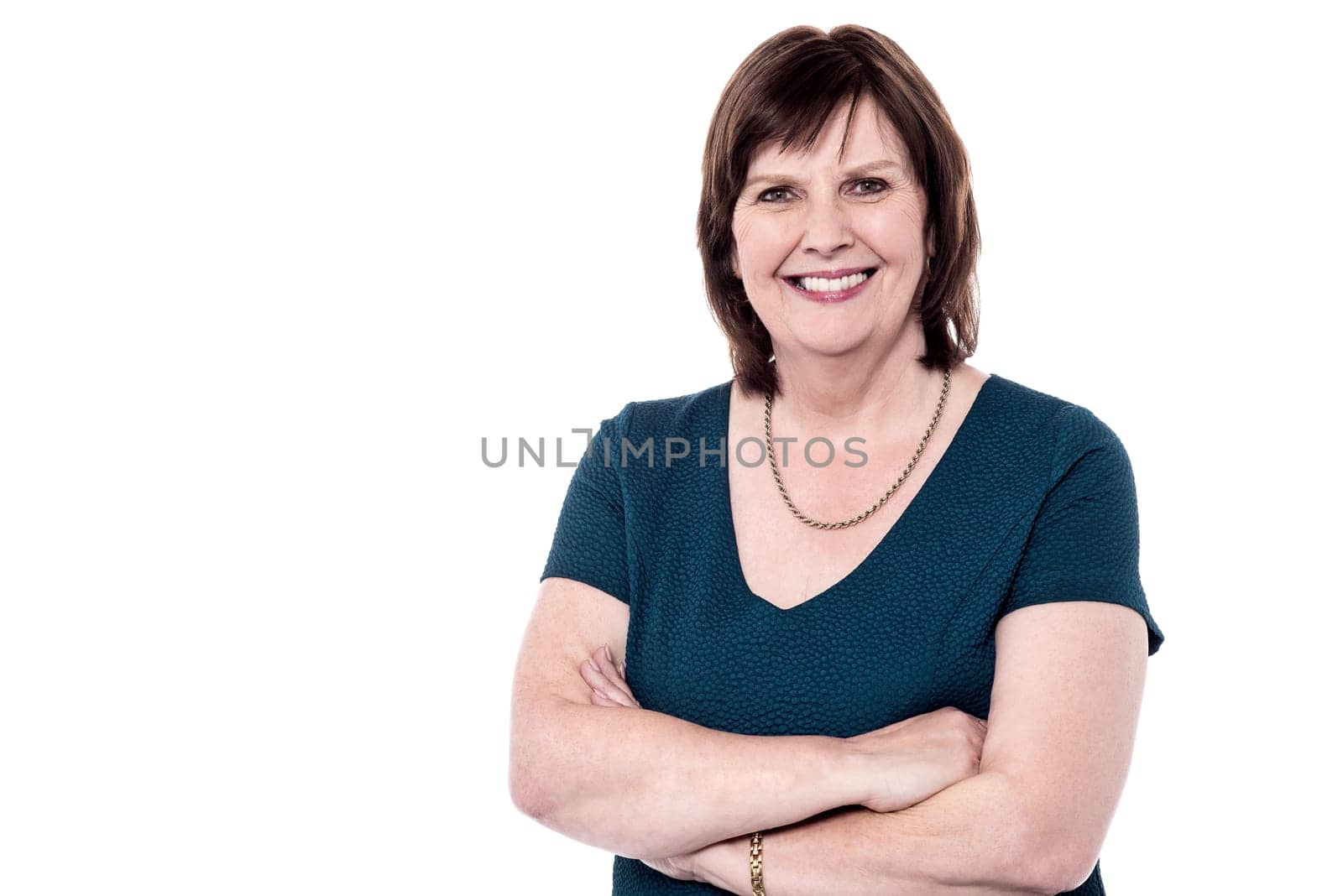 Confident smiling beautiful aged woman in trendy wear