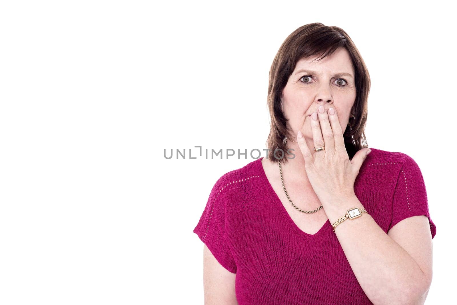 Picture of senior woman with hand over mouth