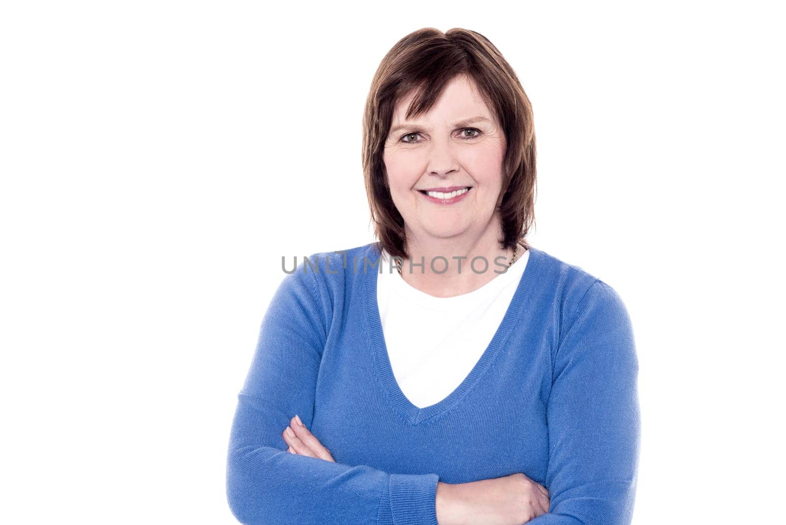 Portrait of elderly woman posing with folded arms