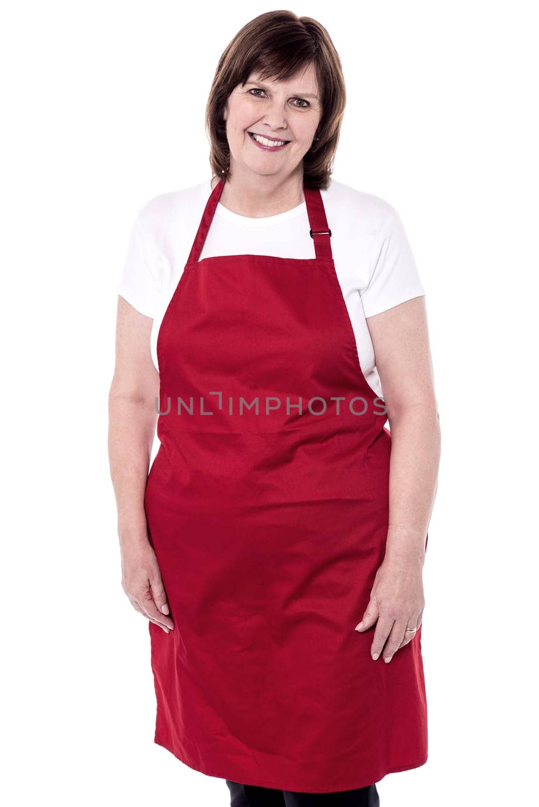 Senior chef posing to camera over white