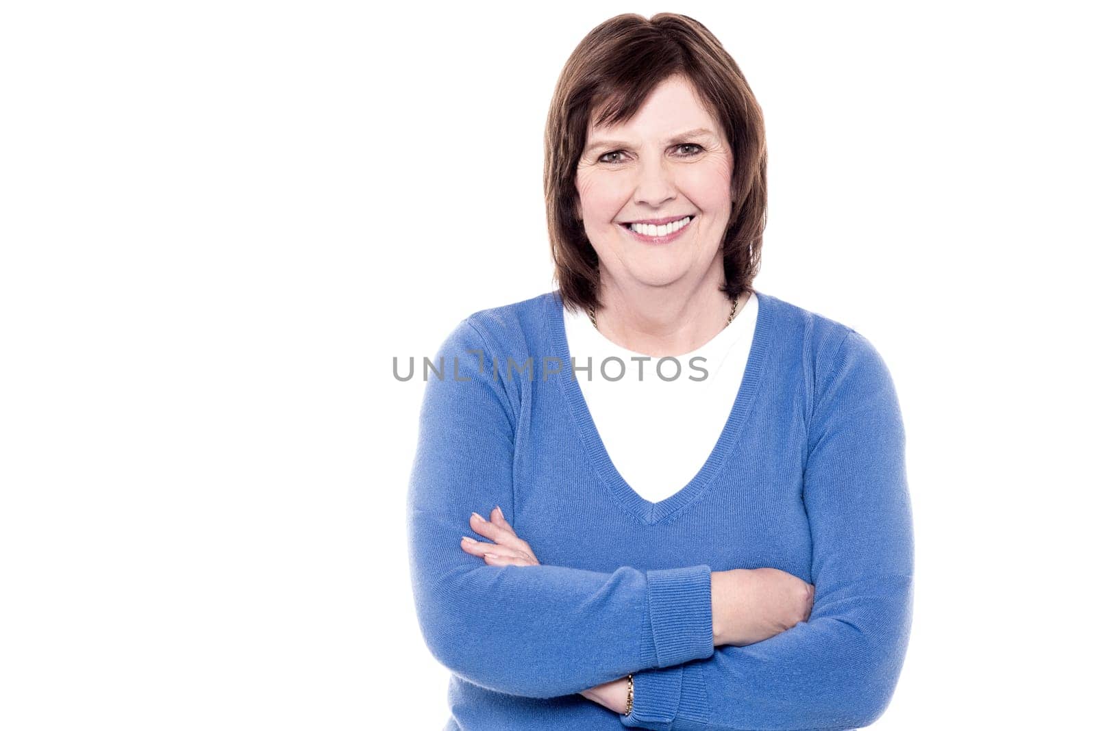 Happy smiling retired senior woman looking at camera