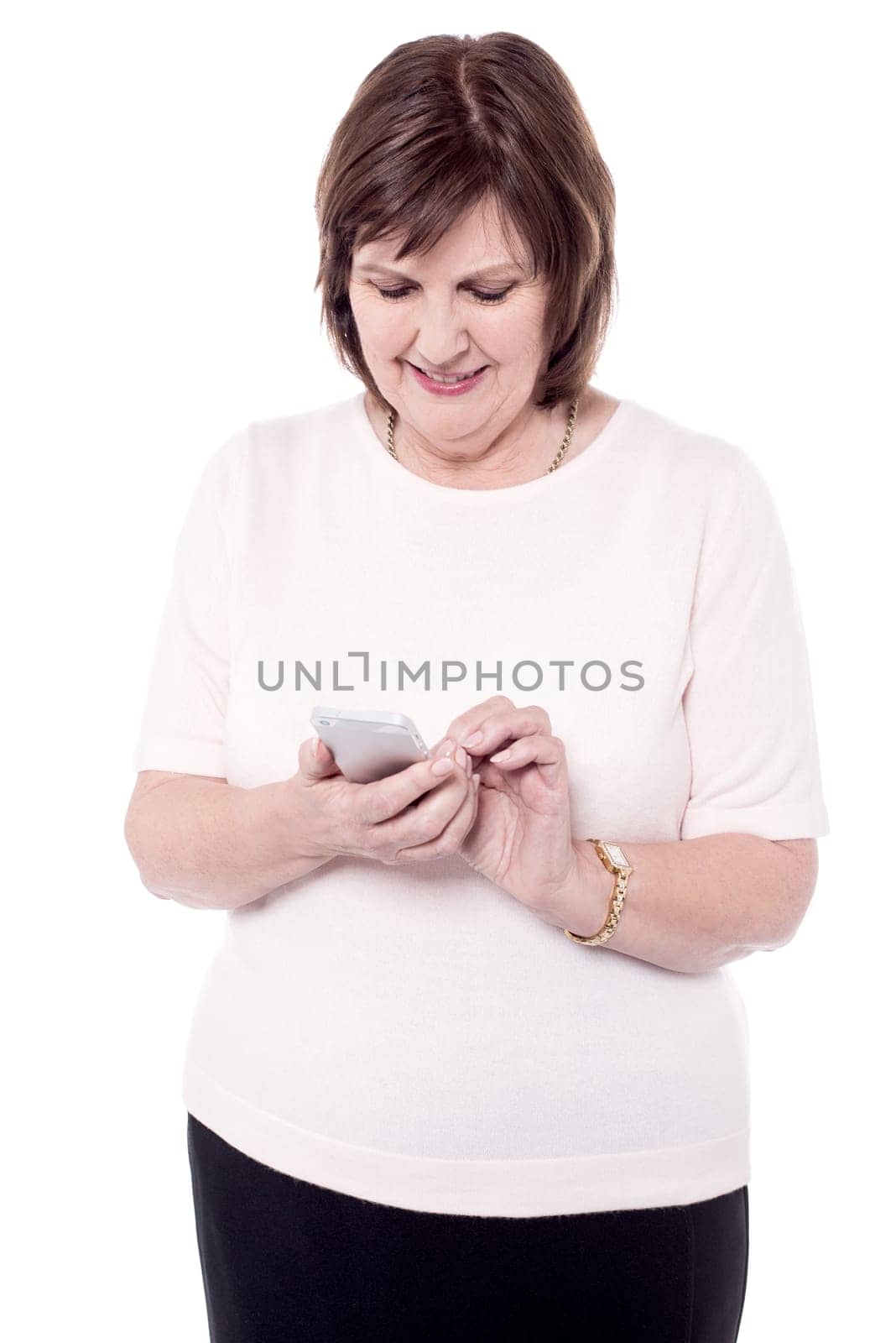 Happy senior woman using her mobile phone