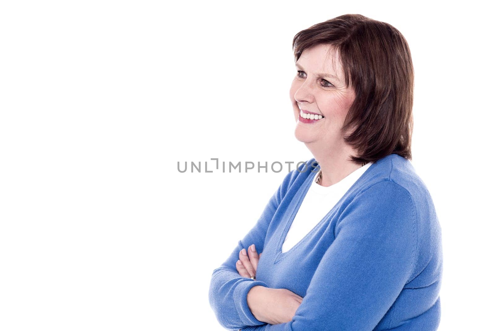 Side pose of elder woman with crossed arms