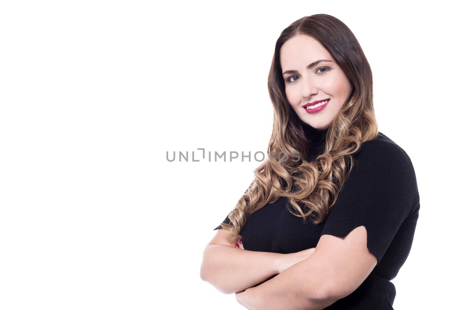 Confident woman dressed in casual wear with crossed arms