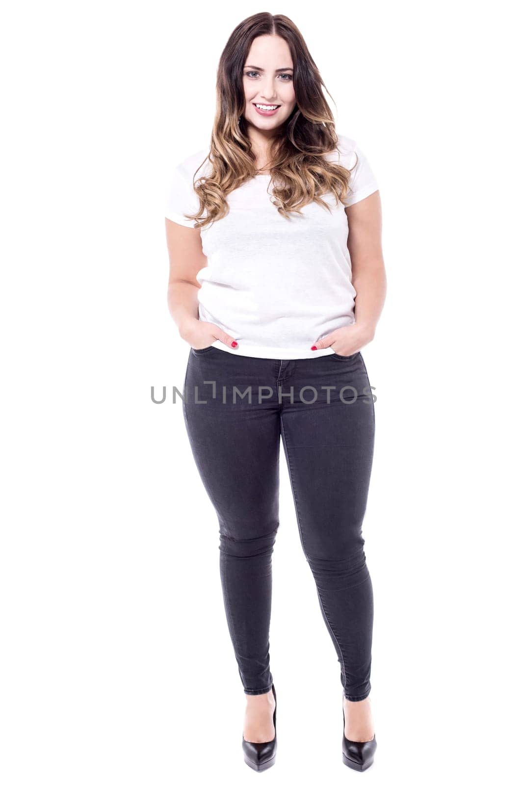 Full length image of pretty woman with hands in pockets