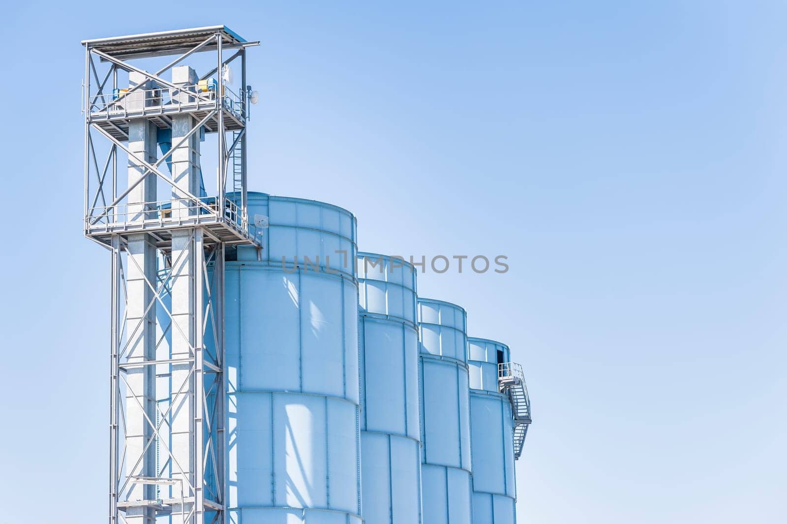 Detail of chemical plant, silos and pipes
