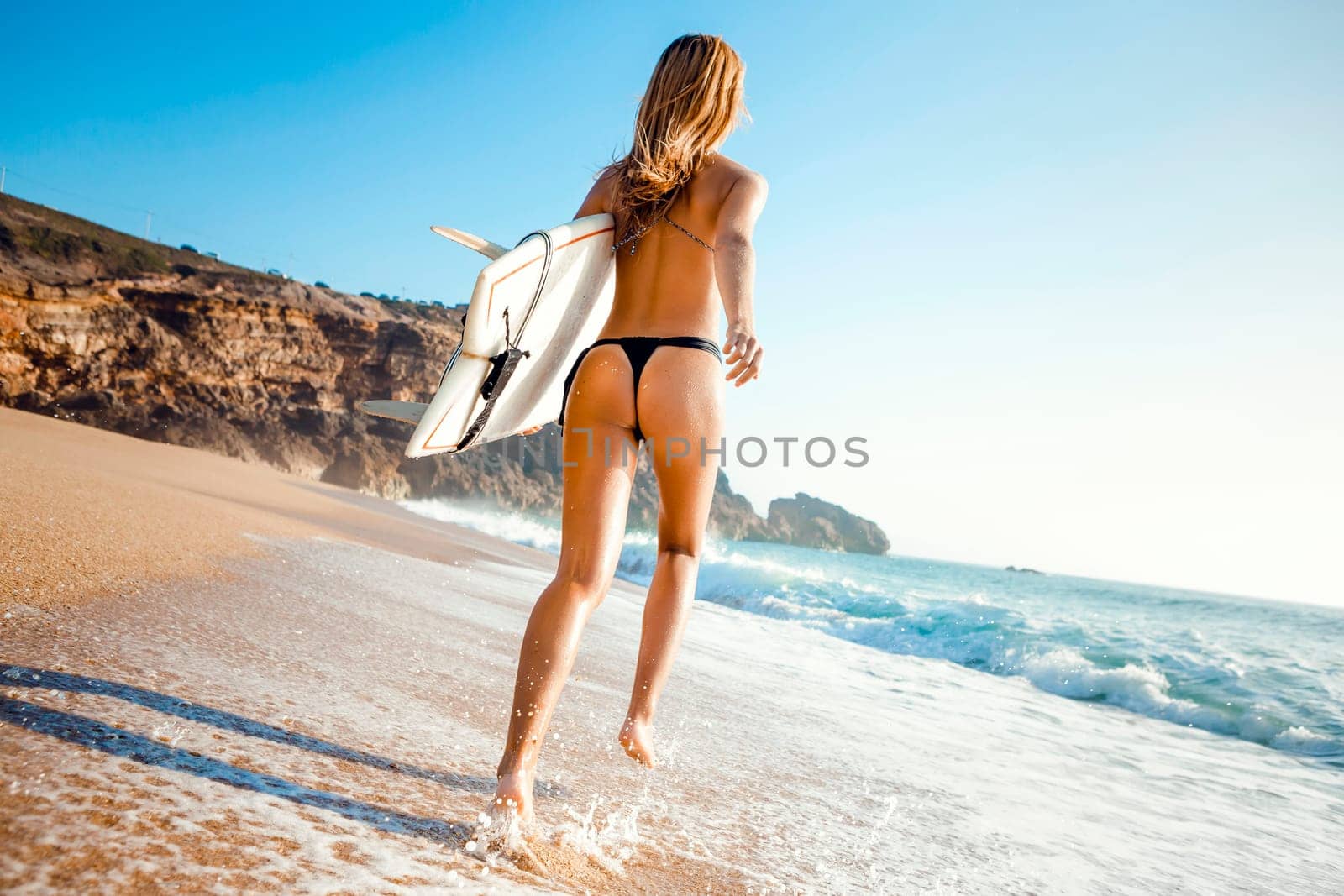 Beautiful and sexy woman at the beach enjoying the day