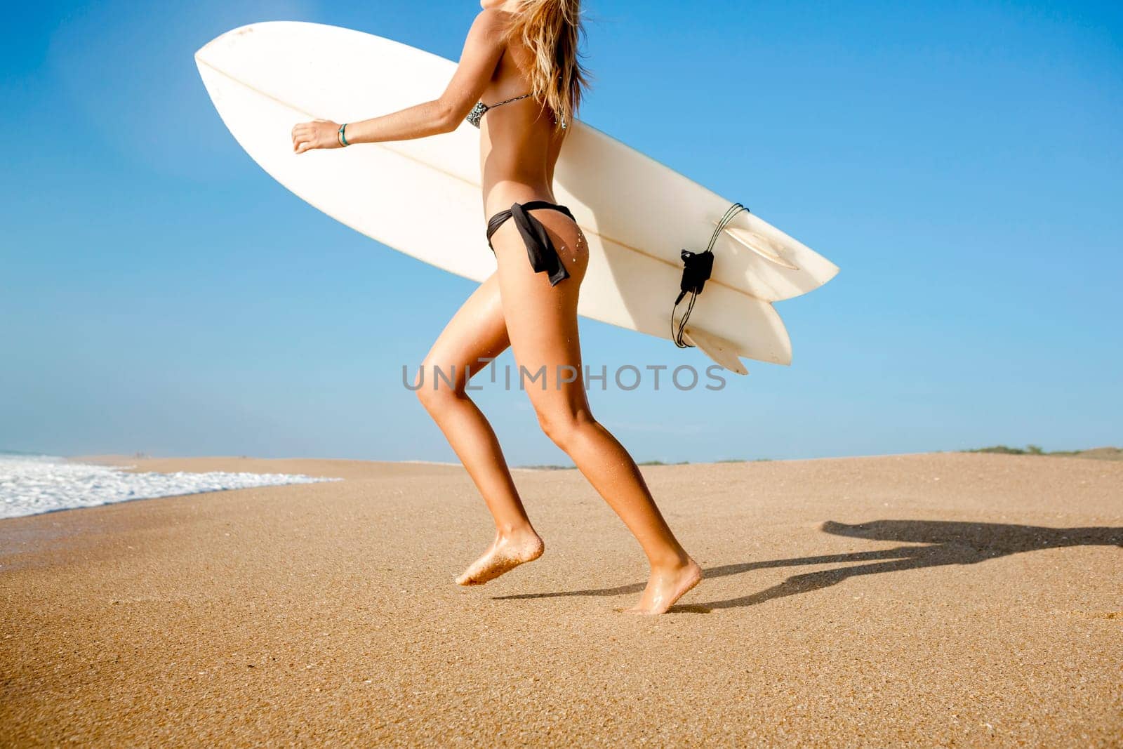Beautiful and sexy woman at the beach enjoying the day