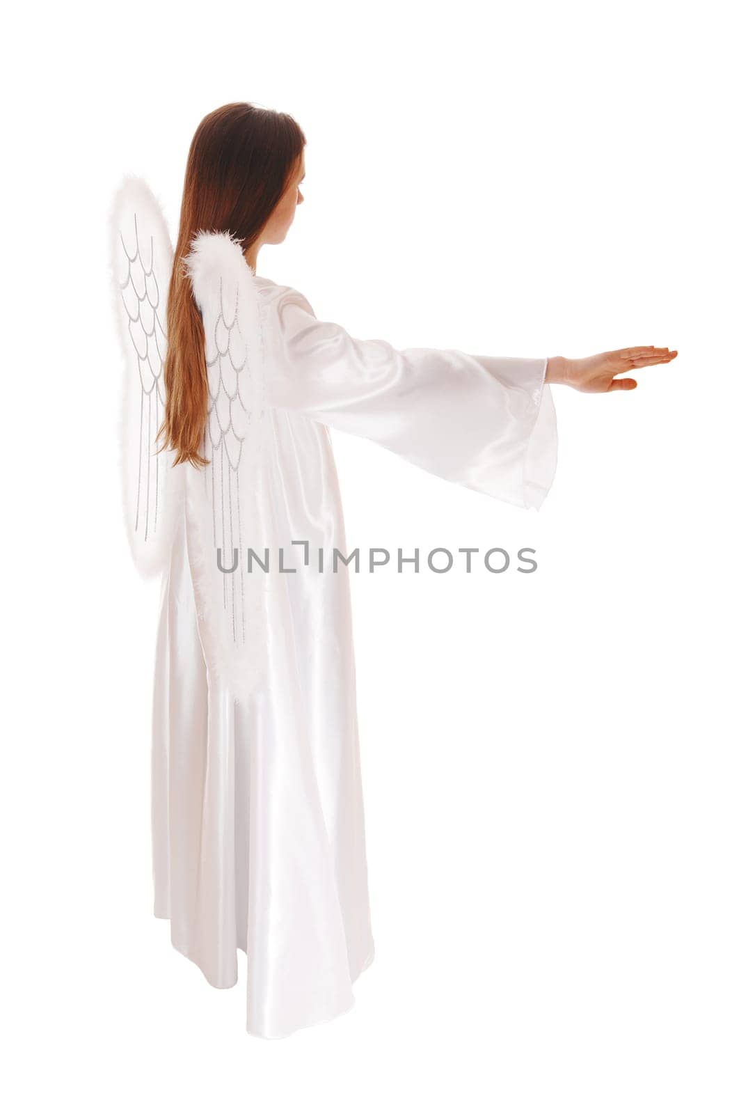 An angel in a long white satain dress with wings and long brown hair.standing in profile wit arms streched out, isolated for white background..
