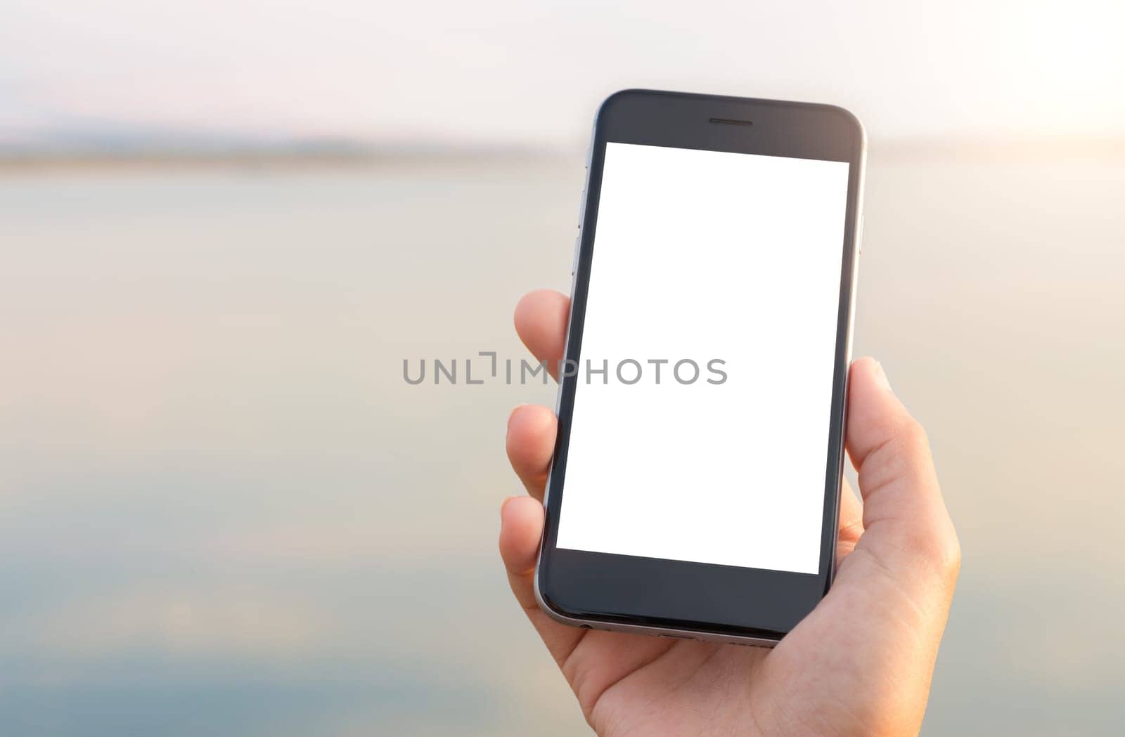 hand holing phone white screen at outdoor lifestyle