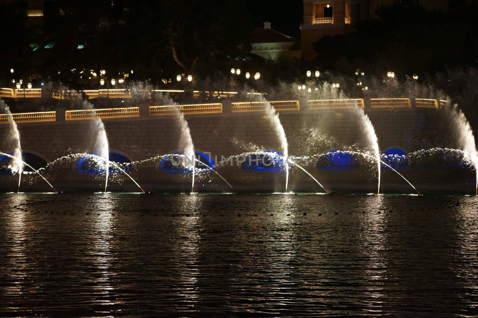 Las Vegas,United States - December 23,2015: The famous water show in front of the luxury Bellagio hotel with water fountains and colorful lighting on Las Vegas Boulevard on the night of December 23,2015 in Las Vegas.