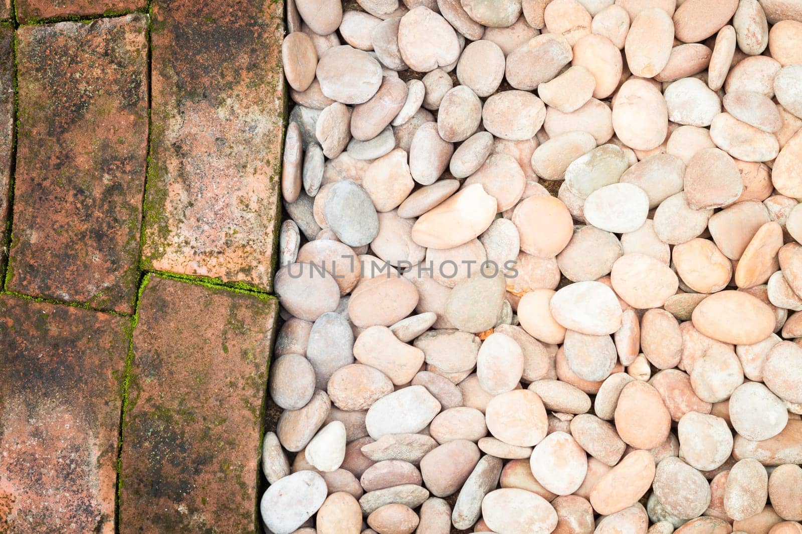 Pebble stones and bricks abstract background, stock photo