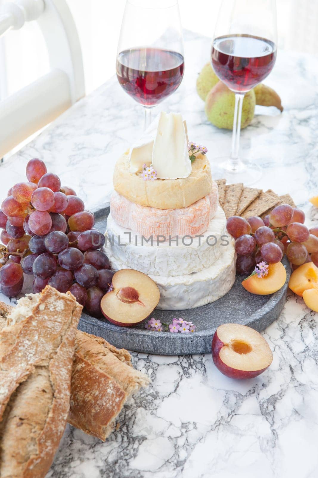 Stacks of different soft caess with fresh fruit