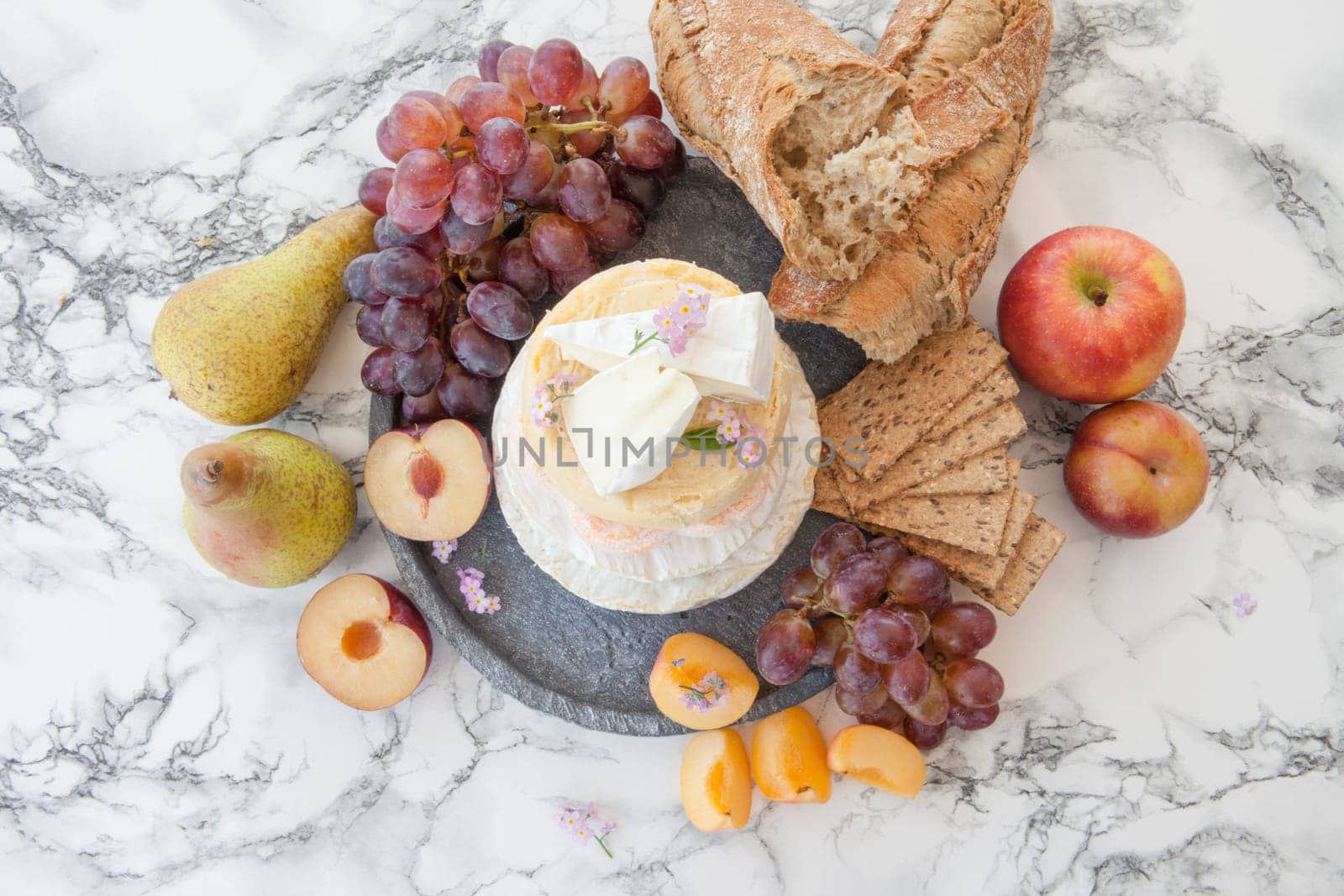 Stacks of different soft caess with fresh fruit