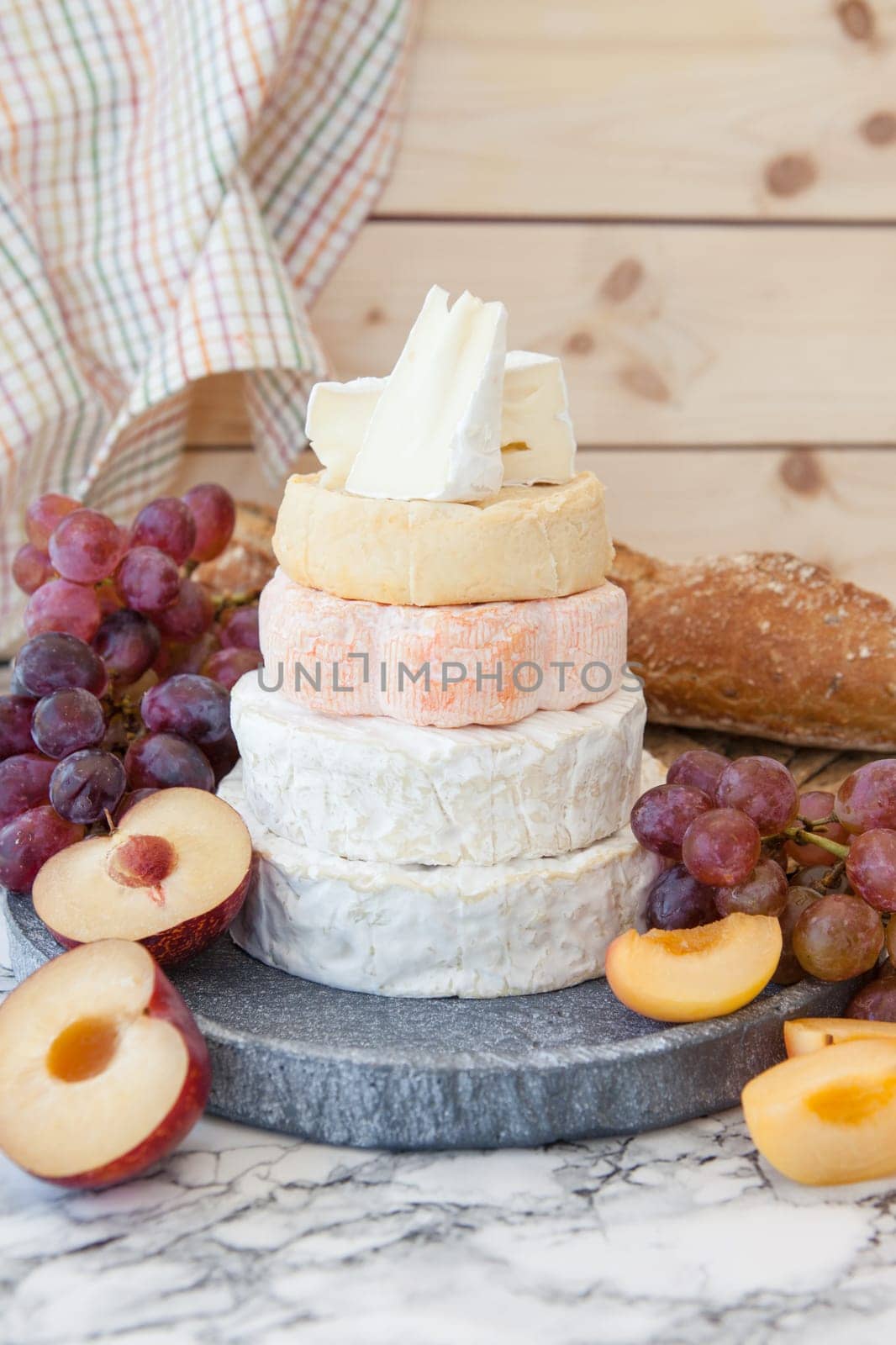 Stacks of different soft caess with fresh fruit
