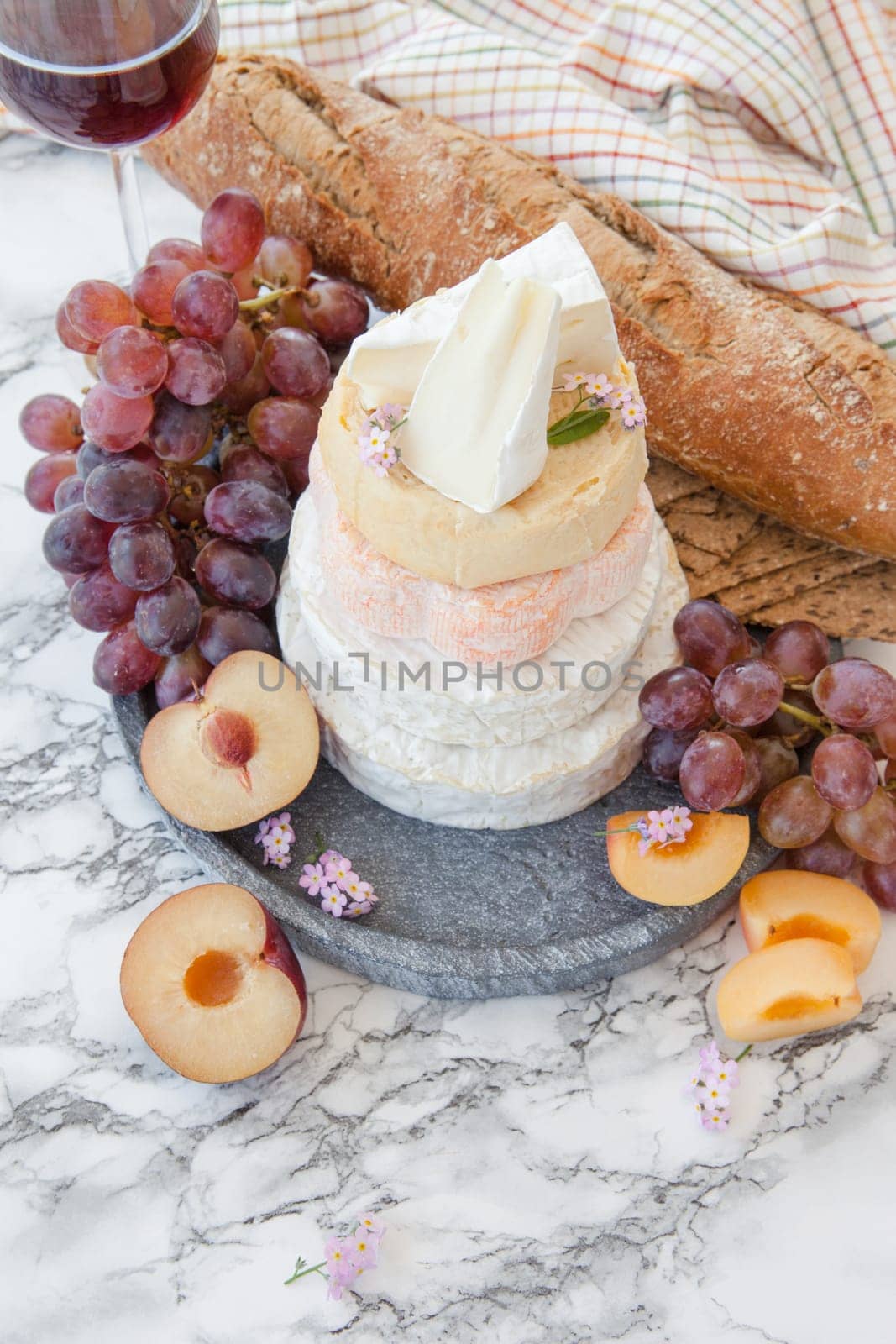 Stacks of different soft caess with fresh fruit