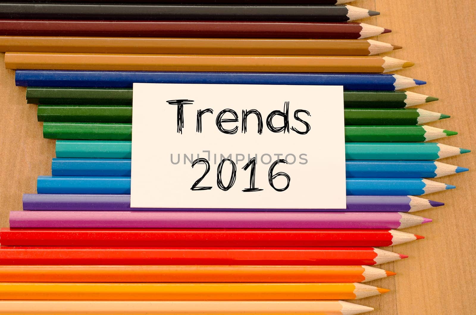 Trends 2016 text concept and colored pencil on wooden background