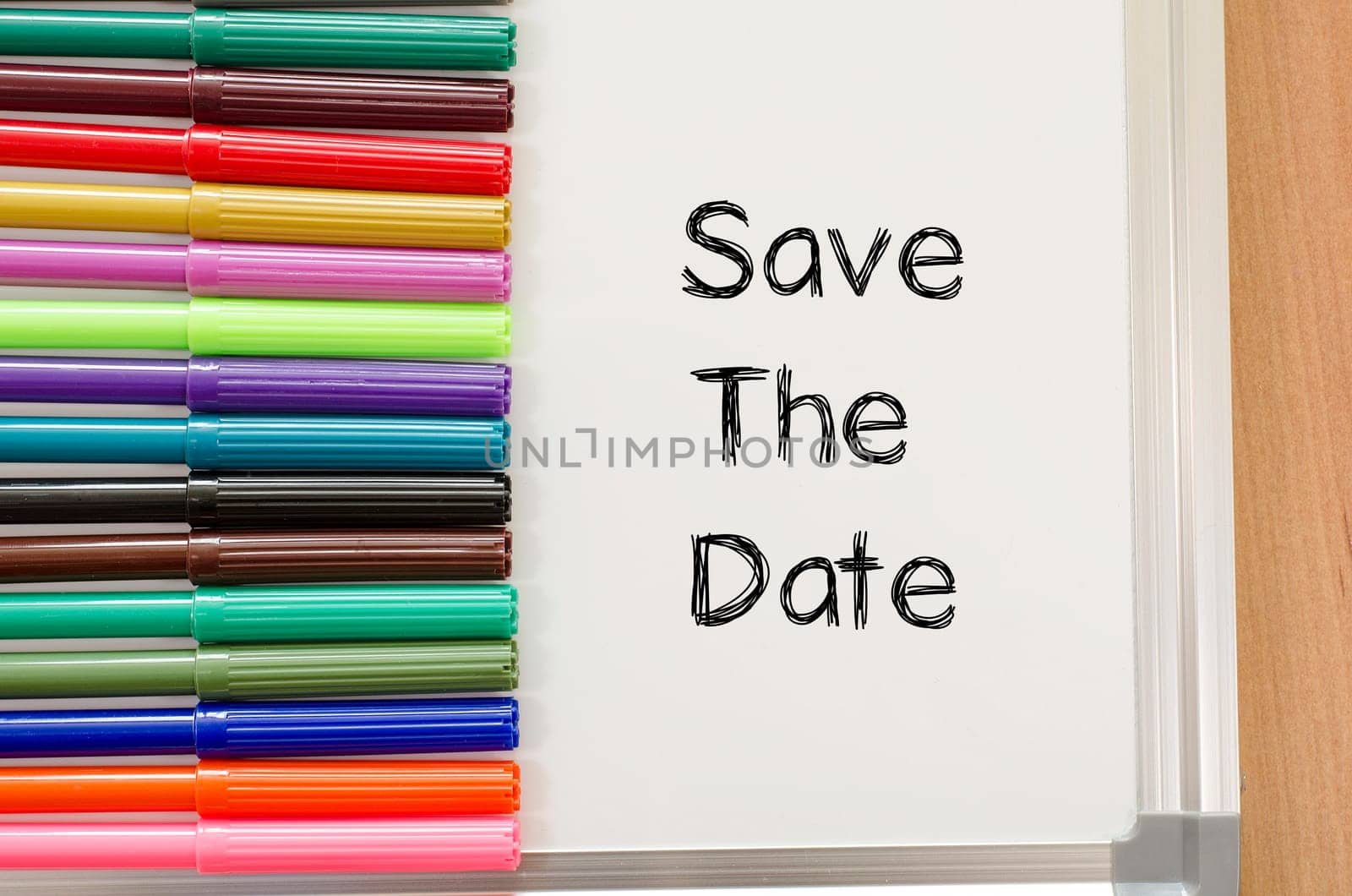 Save the date text concept and colored pens