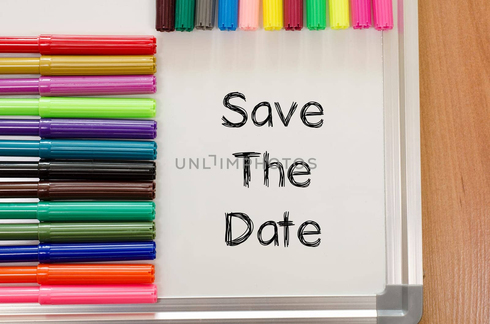 Save the date text concept and colored pens