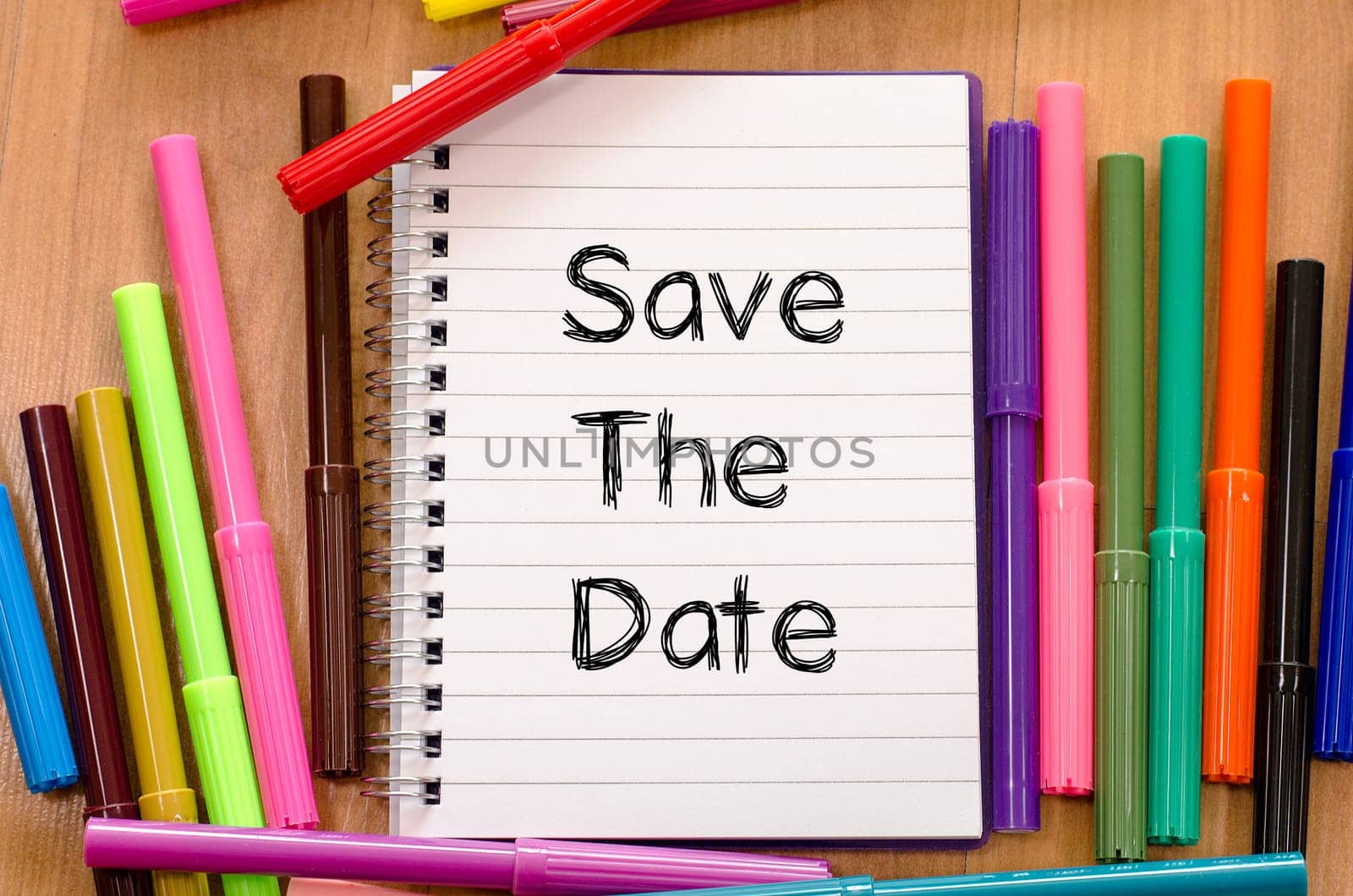 Save the date text concept and colored pens