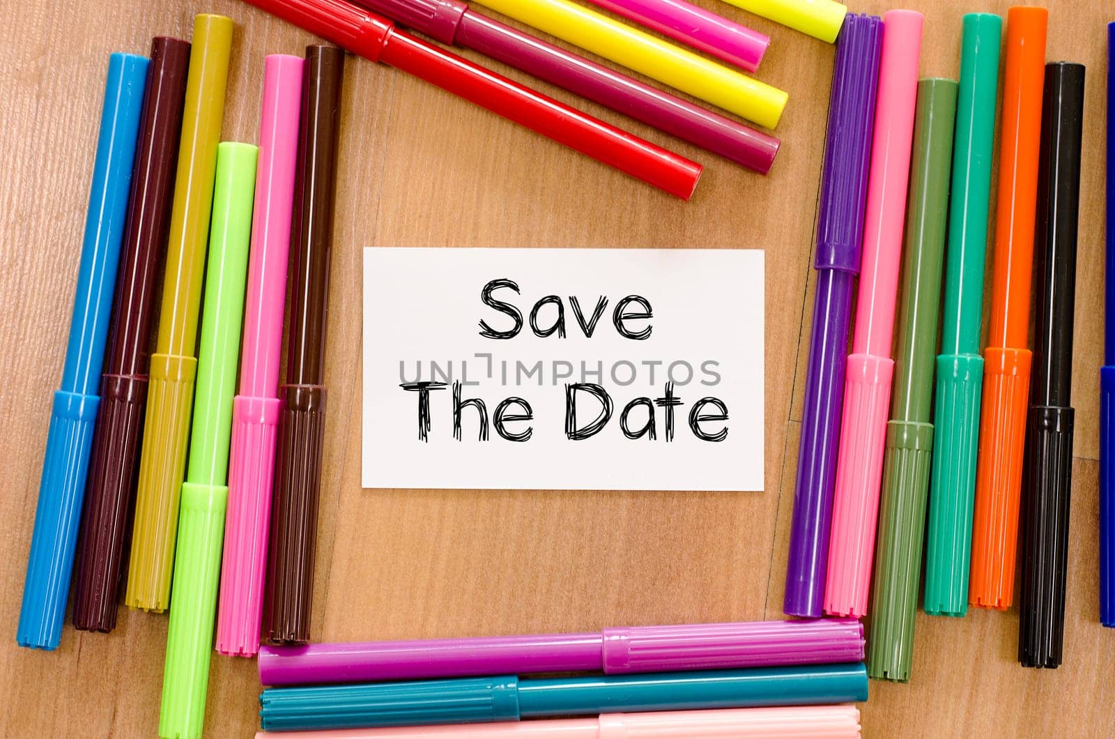 Save the date text concept and colored pens