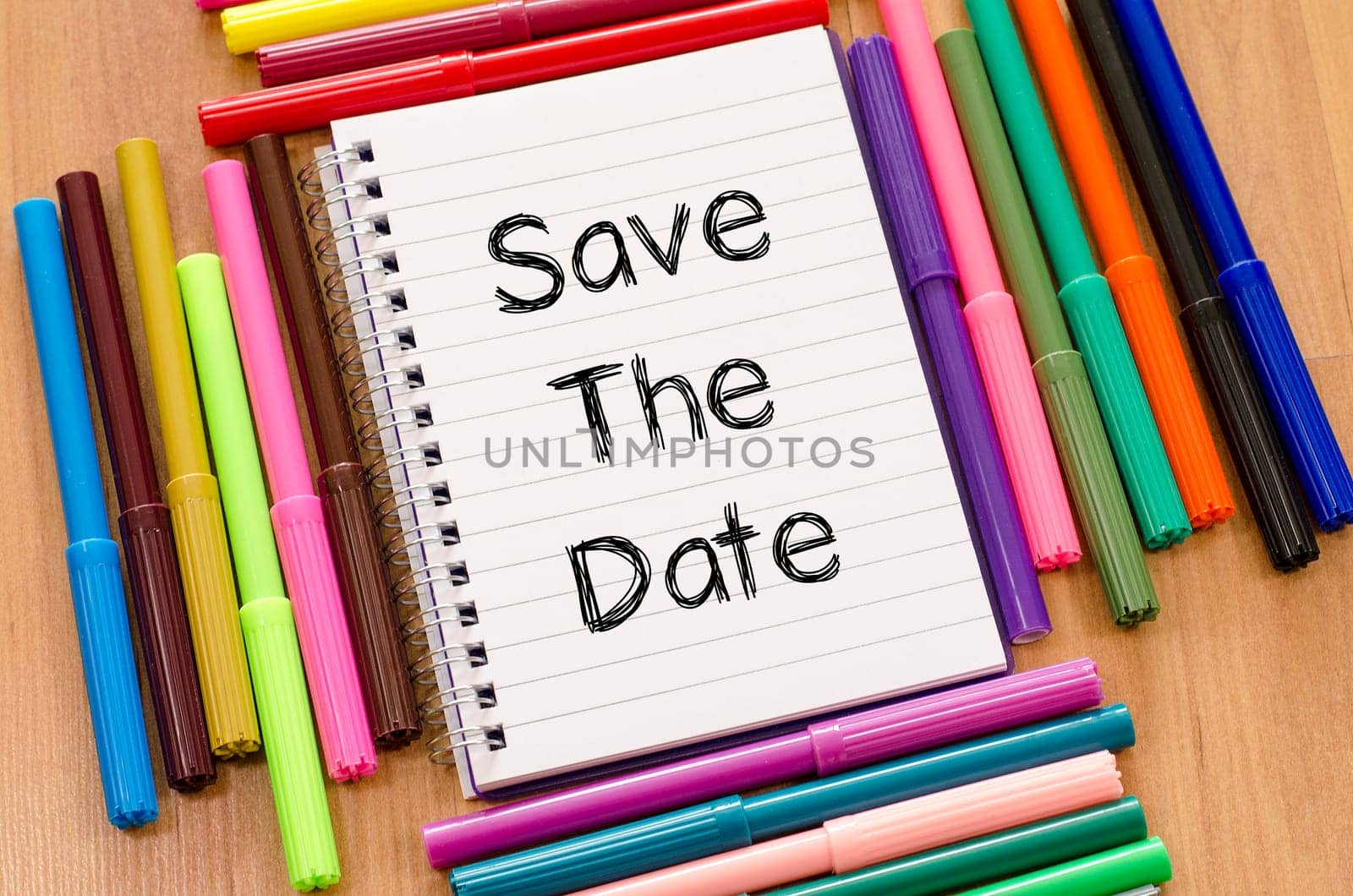 Save the date text concept and colored pens