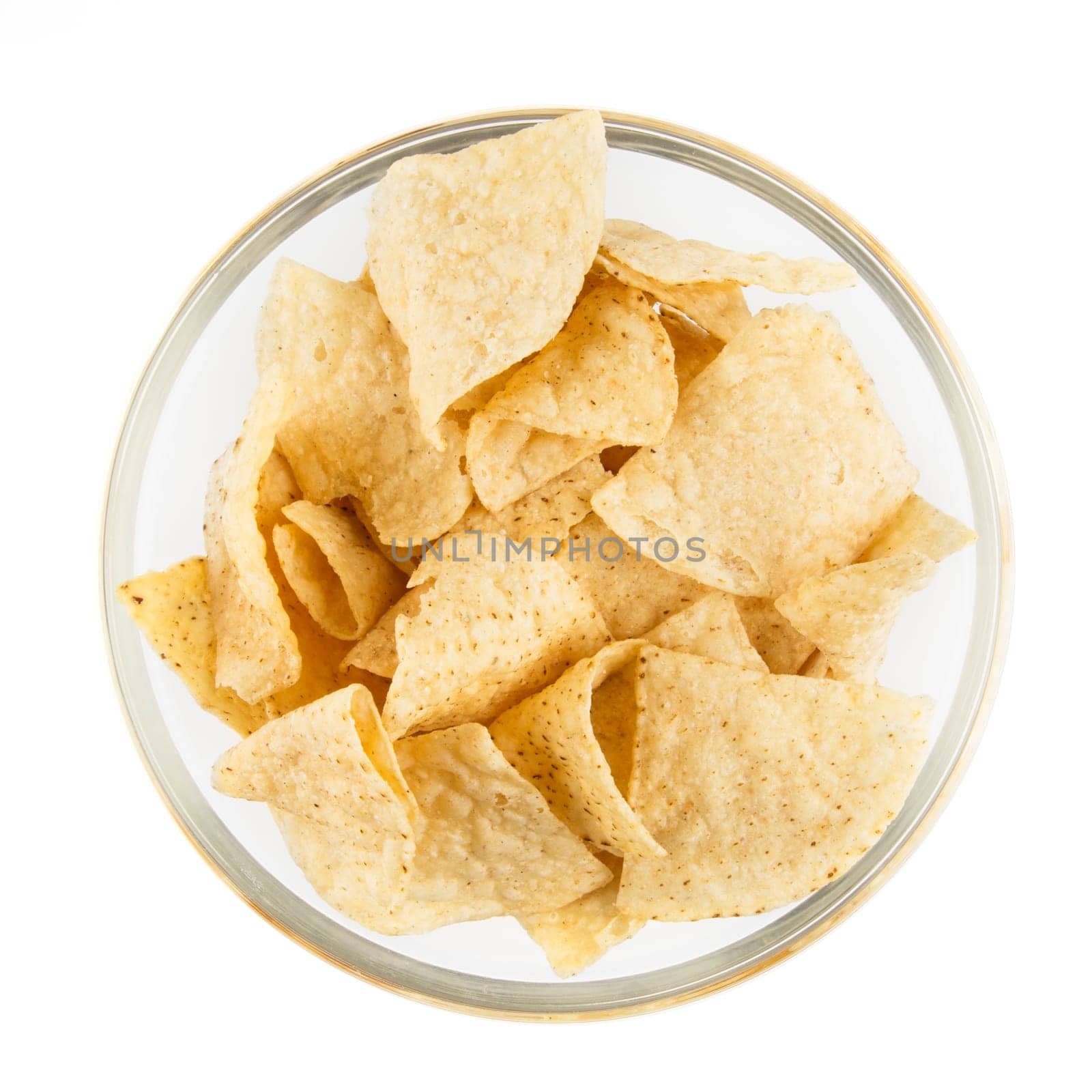Bowl of fresh tortilla chips isolated on white and viewed from above.