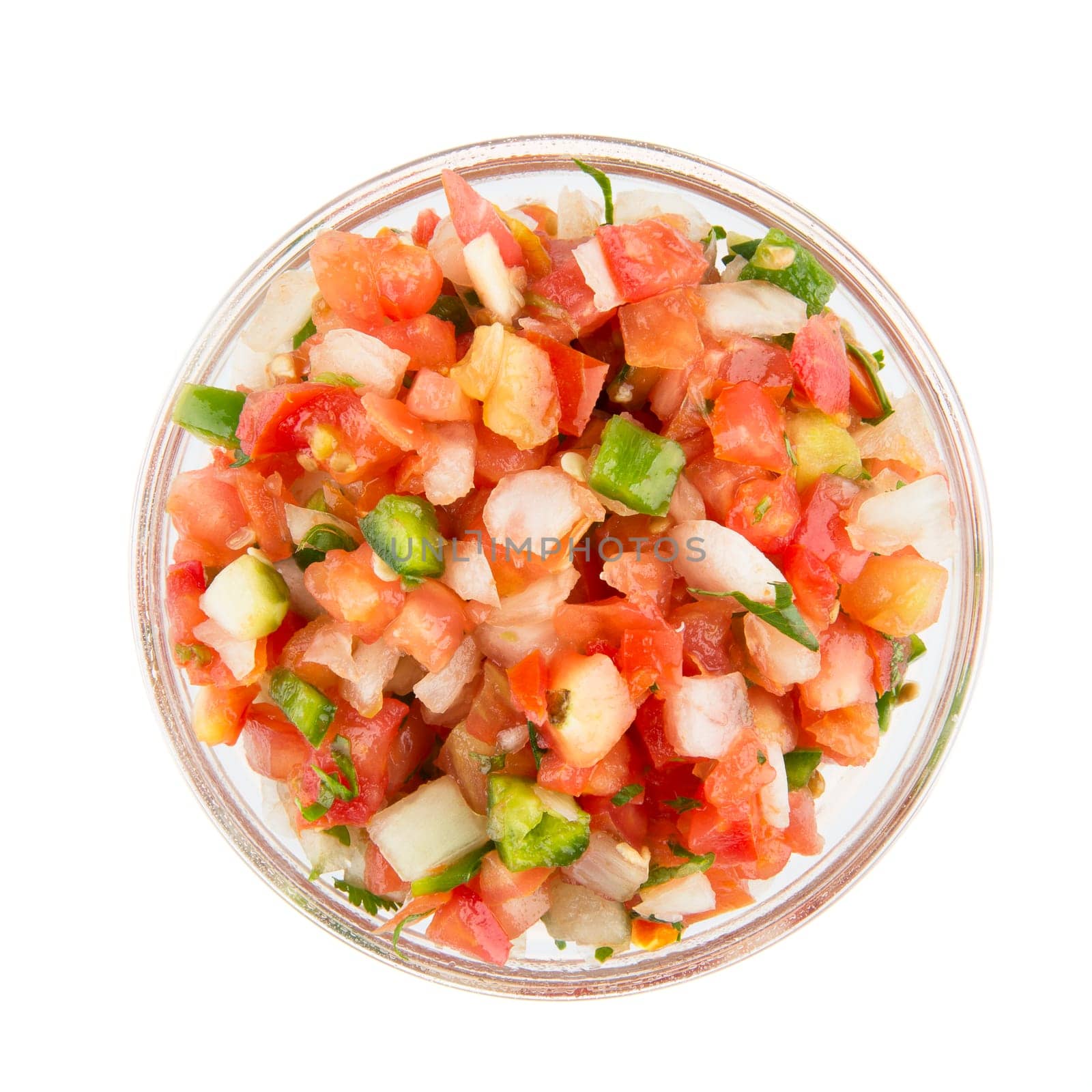 Bowl of fresh pico de gallo isolated on white and viewed from above.