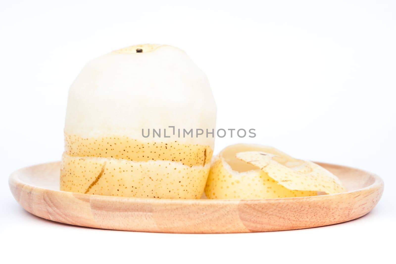 Peeled Chinese pear on white background, stock photo