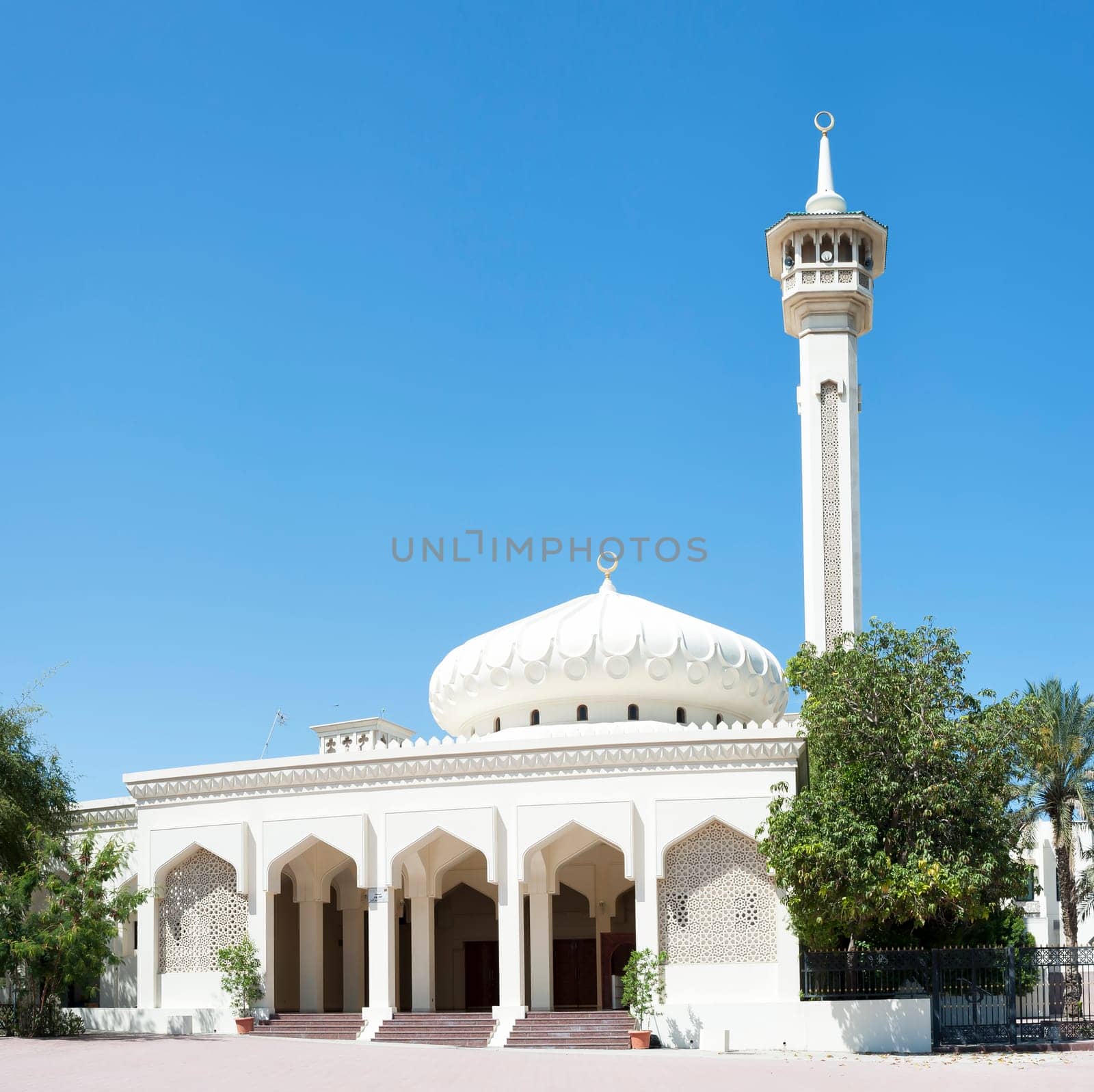 Dubai, a mosque and a minaret. Muslim religion.
