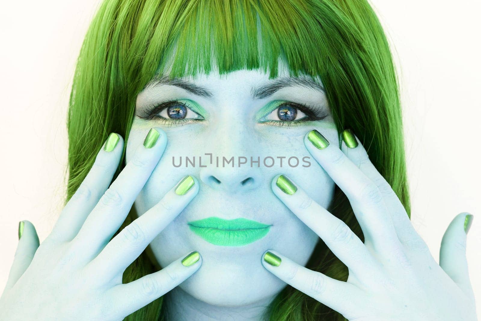 The woman with the green hair and the green makeup